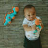 Picture of Dinosaur Rattle Steggy Turquoise - Free Trade 100% Cotton - by Pebble