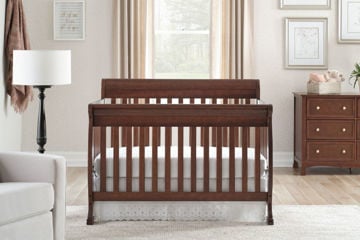 white crib brown dresser